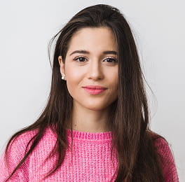 A women in a pink sweater